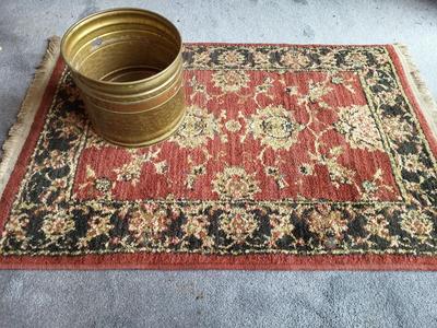 THROW RUG AND A BRASS POT
