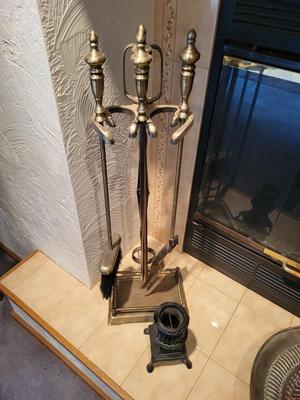 FIREPLACE TOOLS IN A HOLDER AND A CAST IRON WOOD STOVE REPLICA