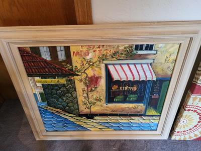 SIGNED PAINTING OF A BISTRO AND CLOTH ON WOOD FRAME