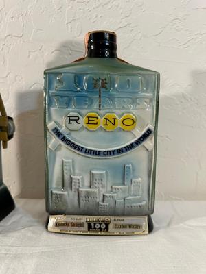 2 RENO JIM BEAM DECANTERS, 1 IS FULL