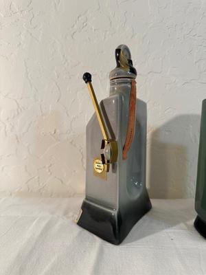 2 RENO JIM BEAM DECANTERS, 1 IS FULL