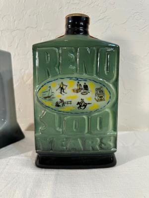 2 RENO JIM BEAM DECANTERS, 1 IS FULL