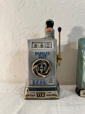 2 RENO JIM BEAM DECANTERS, 1 IS FULL