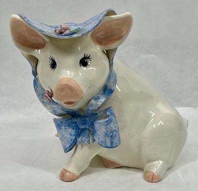 Pig in blue bonnet