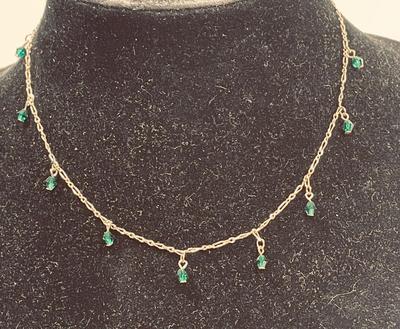 goldtone necklace with emerald green stones