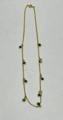 goldtone necklace with emerald green stones