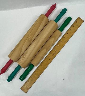 3 small wooden rolling pins with plastic handles