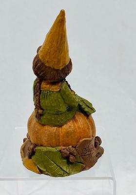 Figurine: Young Girl Seated next to Pumpkin