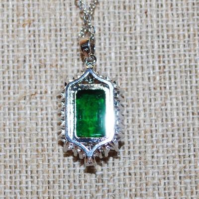 Deep Green Emerald Style Cut Stone PENDANT (1¼" x ¾") + Full Clear Stones Surround + Basket Setting on a Silver Tone Necklace...