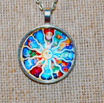 Round Graphic Designed "Sun god" PENDANT (1" Diam.) on a Silver Tone Necklace Chain 17" L
