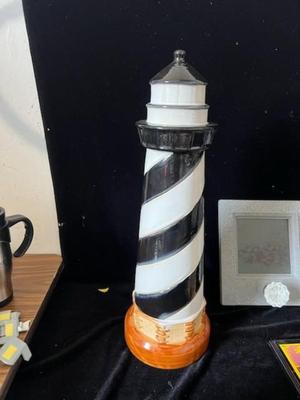 2 WALL HUNG COAT RACKS AND A CERAMIC LIGHTHOUSE