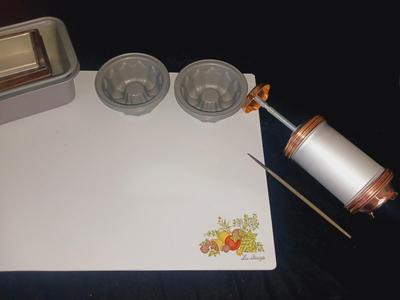 GLASS CUTTING BOARD, COOKIE PRESS, SMALL MOLDS AND LOAF PANS