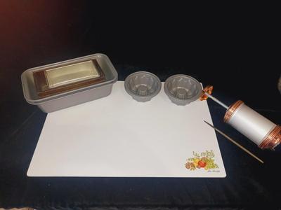GLASS CUTTING BOARD, COOKIE PRESS, SMALL MOLDS AND LOAF PANS