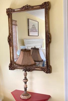 LOT 28: Gold Tone Framed Wall Mirror and Fringed Table Lamp