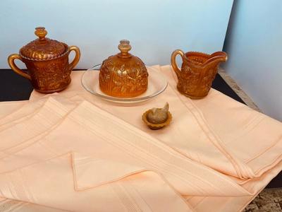 Beautiful Carnival Glass items and Miniature Nesting Hen Covered Dish with Peach Table Cloth