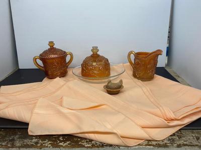 Beautiful Carnival Glass items and Miniature Nesting Hen Covered Dish with Peach Table Cloth