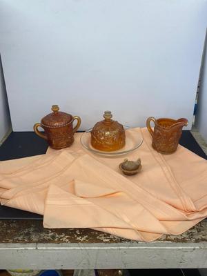 Beautiful Carnival Glass items and Miniature Nesting Hen Covered Dish with Peach Table Cloth