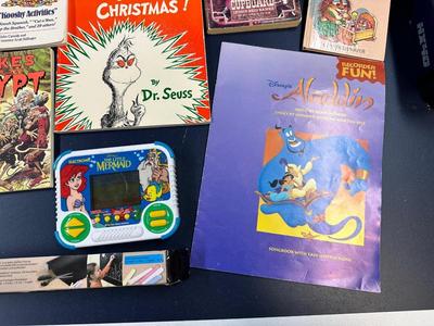 CHILDREN'S BOOKS AND 2 HAND HELD GAMES