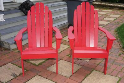 PAIR OF RED WOOD ANIRONDACK PATIO CHAIRS.