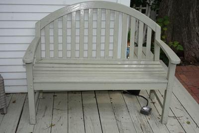 WOODEN GARDEN BENCH PAINTED A SOFT GREEN/ GREY TONE.
