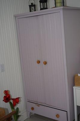 WOOD PAINTED A LAVENDER COLOR WITH NATURAL KNOBS WAINSCOT WARDROBE CABINET W/ DRAWER