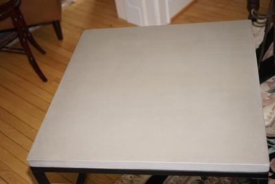 CONTEMPORARY STYLE STRONG BLACK METAL BASE - SQUARE FRAMED WITH A TAN COLOREDSTONE TOP.