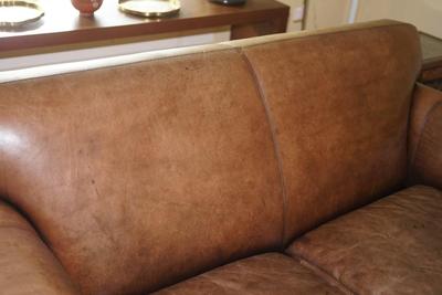 QUALITY MADE TWO CUSHION BROWN LEATHER SOFA WITH STRESSED LEATHER LOOK