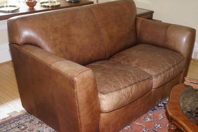 QUALITY MADE TWO CUSHION BROWN LEATHER SOFA WITH STRESSED LEATHER LOOK