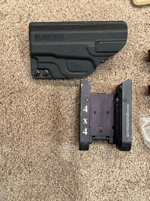 2 PISTOL HOLSTERS, SAFETY GLASSES AND SHELL SPEED STRIPPERS