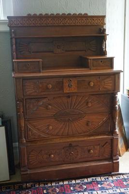 EXCEPTIONAL LATE 19TH CENTURY WALNUT BUREAU W/ SUNBURST STYLE CARVING AND GALLERY TOP