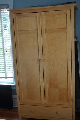 WOOD TWO DOOR ARMOIR CABINET OF LIGHT MAPLE COLOR