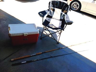 OZARK TRAIL FOLDING CHAIR, 2 FISHING POLES AND A COOLER