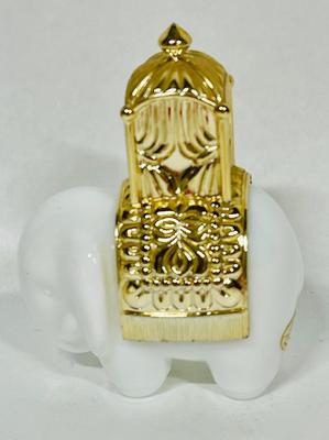 VIntage 1970 Avon Royal Milk Glass Elephant with some Charisma Cologne still inside