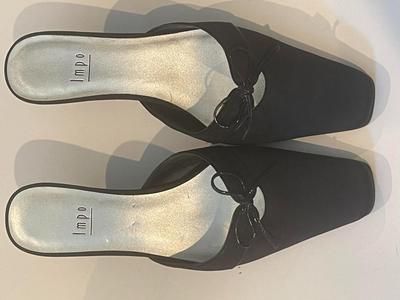Brand New black mules by Impo in size 6.5