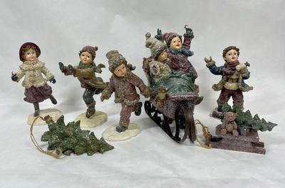 Set of Winter Christmas Themed Figurines Children on Skates and Sled