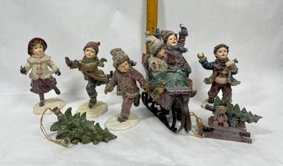 Set of Winter Christmas Themed Figurines Children on Skates and Sled