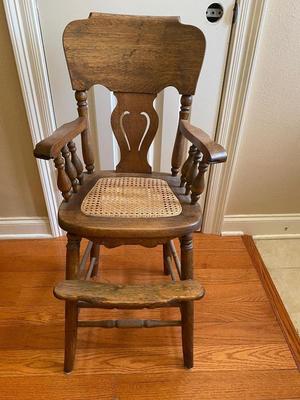 Antique solid wood highchair with cane seat
