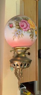 Antique wall-mounted oil lamp