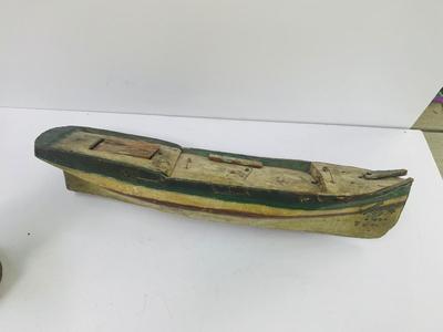 Antique carved Shipwrecked boat and fisherman figure with framed boat artwork