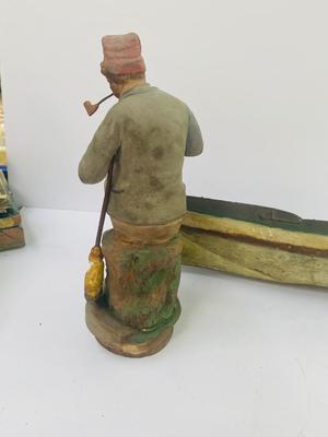 Antique carved Shipwrecked boat and fisherman figure with framed boat artwork