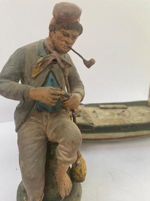 Antique carved Shipwrecked boat and fisherman figure with framed boat artwork