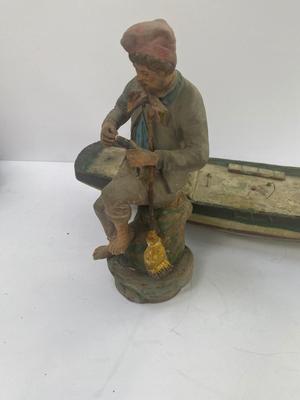 Antique carved Shipwrecked boat and fisherman figure with framed boat artwork