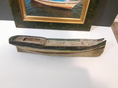 Antique carved Shipwrecked boat and fisherman figure with framed boat artwork