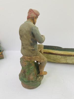 Antique carved Shipwrecked boat and fisherman figure with framed boat artwork