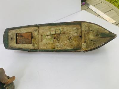 Antique carved Shipwrecked boat and fisherman figure with framed boat artwork