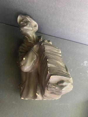 WORKING MAN WITH A STACK OF PAPERS AND BRONZE PLAQUE