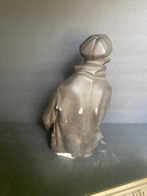WORKING MAN WITH A STACK OF PAPERS AND BRONZE PLAQUE