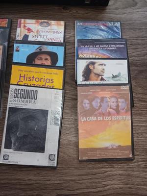 Samsung Dvd player and remote with a variety of dvd movies in different languages