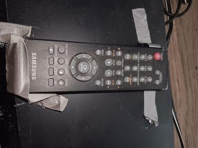 Samsung Dvd player and remote with a variety of dvd movies in different languages