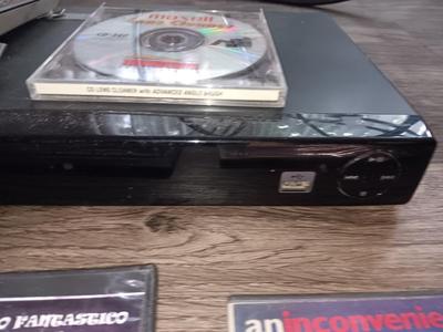 Samsung Dvd player and remote with a variety of dvd movies in different languages